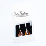 Pretty shaped honey or cherry coloured amber drop earrings