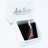 Eye-catching honey amber triangle pendant