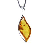 Striking and elegant Cognac Amber Pendant featuring silver and amber